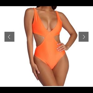 Orange one piece bikini.